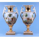 A pair of Paris Porcelain two-handled vases decorated with landscape scenes, the handles in the form