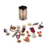 A group of WWII medals to include The France & Germany Star, The Africa Star, The 1939-45 Star,