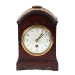 A 19th century mantle clock, the 10cms diameter white enamel dial with Arabic numerals and fitted