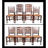 A set of eight North Country style ladderback chairs with rush seats to include two carvers (8).