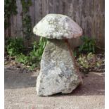 A well weathered staddle stone, 78cms high.