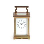 A carriage clock, the white enamel dial with Roman numerals, signed 'J. A Wheatley, Carlisle', in