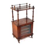 A Victorian walnut whatnot music stand with two tiers with urn & swag inlaid decoration above a