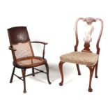 An Arts & Crafts William Birch inspired carver chair with leather and cane work back with cane