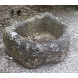 A D shaped carved stone planter, 50cms wide.