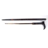 An Anglo-Indian sword stick with carved decoration, 95cms long, blade length 46cms.
