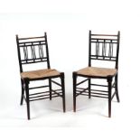 A pair of William Morris style Sussex occasional chairs with rush seats (2).Condition ReportBoth