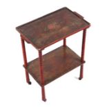 A Japanese lacquer two-tier trolley with bobbin turned supports, 49cms wide.