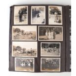 An early 20th century family photo album depicting images of cars, military, topographical