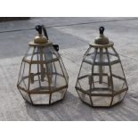 A large pair of outdoor wall lamps of octagonal form, on metal brackets, 76cms high; together with a