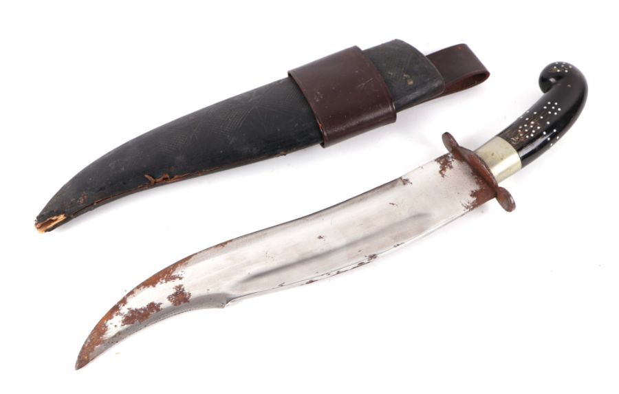 A 20th century Indian Bhuj (Kutti) knife in its leather covered wooden scabbard. Blade length