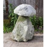 A well weathered staddle stone, 85cms high.