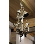 A silvered metal light fitting surmounted with three cherubs.