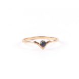 A 9ct gold sapphire solitaire ring, approx UK size .M', 0.8g.