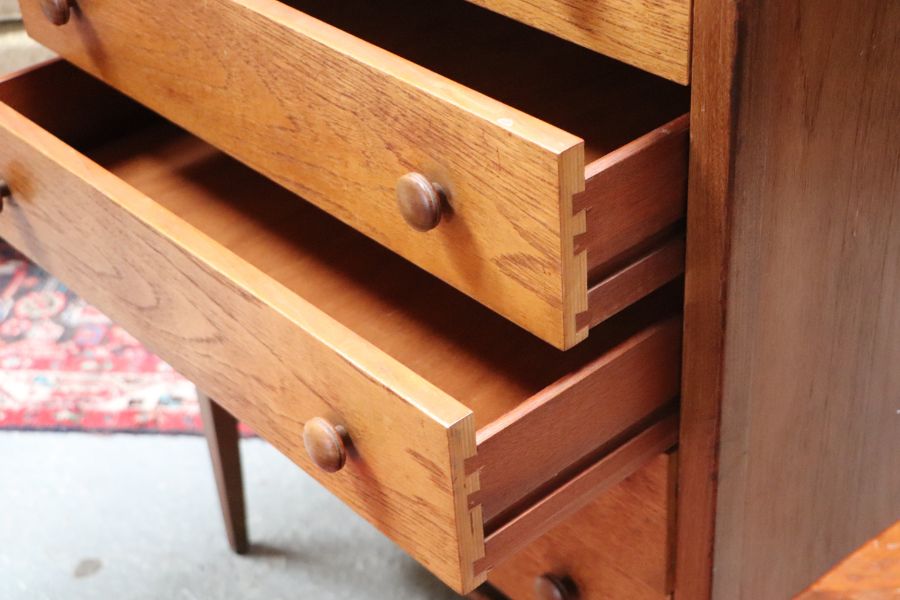 A mid 20th century teak chest in the manner of Heal's with an arrangement of five long drawers, on - Image 5 of 7
