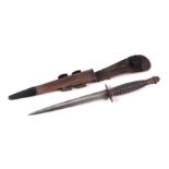 A Fairbairn Sykes style fighting knife with leather scabbard, 30cms long.