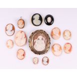 A shell cameo brooch depicting Madonna and child within a Pinchbeck frame, 6cms diameter; together