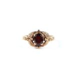 A 9ct gold and solitaire garnet ring, approx UK size 'L', 2.9g.