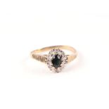 A 9ct gold diamond and sapphire cluster ring, approx UK size 'O', 1.9g.