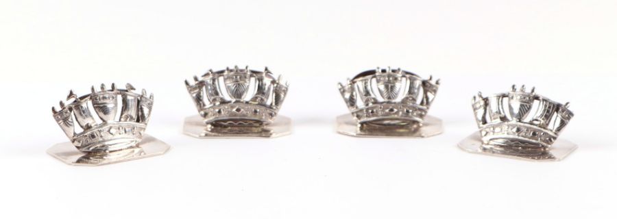 A set of four Chinese white metal menu stands in the form of crowns, marked 'Tai Hua', 53g (4).