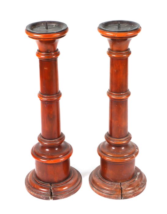 A pair of 19th century fruitwood floor standing pricket or candlesticks with tapering ring turned