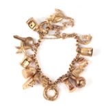 A 9ct gold charm bracelet with 15 charms, 28.9g.