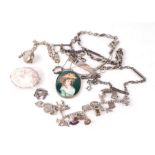 A quantity of assorted silver jewellery to include Albert chains, charm bracelet, identity