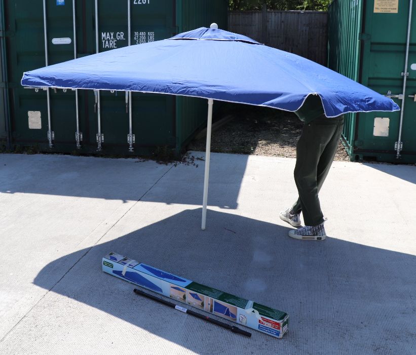 A rectangular garden parasol, waterproof and UV protection, 240 by 175cms, boxed.