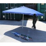 A rectangular garden parasol, waterproof and UV protection, 240 by 175cms, boxed.