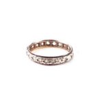 A 9ct gold eternity ring set with white stones, approx UK size 'O', 1.7g.