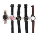 Five Seiko 5 gentleman's wristwatches to include a Seiko 5 military style watch with day date; and