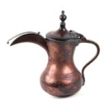 A Turkish / Islamic copper dallah coffee pot, 27cms high.