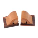 Albert Chuput (20th century French) a pair of rosewood and beech sculptural bookends, 12.5cms high.