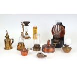 A group of small brass and copper oil and paraffin lamps to include a French Pigeon lamp and a