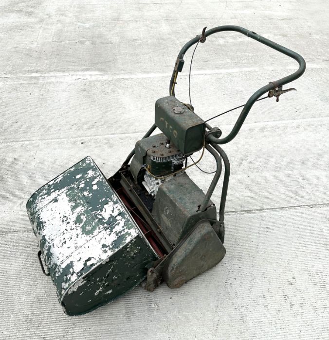 An Atko self propelled petrol lawn mower with 20ins cut blade.