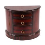 A miniature rosewood bowfronted three drawer chest, purportedly Brights of Nettlebed, 31cms wide.