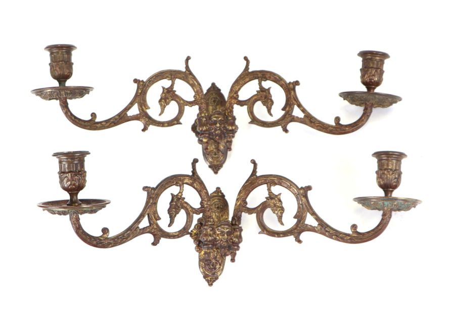 A pair of 19th century French L. Pinet gilt metal twin-arm piano sconces decorated with green man