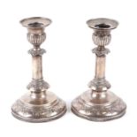 A pair of Swedish silver candlesticks with detachable sconces and loaded bases, both inscribed '