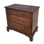 A 19th century mahogany chest of small proportions with two short and two graduated long drawers, on