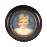 An early 20th century portrait miniature on paper depicting a young girl, framed & glazed, 9.5cms