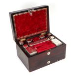 A 19th century rosewood dressing box, the fitted interior with silver plated cosmetic jars and