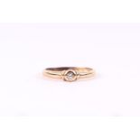 A 9ct gold diamond solitaire ring, approx UK size 'Q', 1.4g.