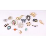 A group of vintage costume jewellery brooches.