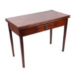 A late Victorian mahogany tea table, the rectangular fold-over top above a central frieze drawer, on
