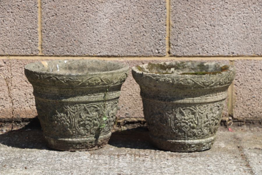 A pair of reconstituted stone circular planters, 34cms diameter (2).