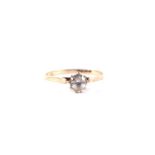 A 9ct gold white sapphire solitaire ring, approx UK size 'N', 1.4g.