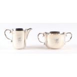 A silver milk jug and sugar bowl with engraved family crest and dated 1937, 306g (2).