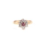 A 9ct gold white and pink stone flower head ring, approx UK size 'N', 1.8g.