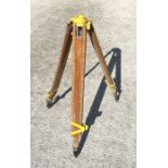 A surveyor's theodolite tripod stand with extending legs.