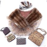 A vintage snakeskin handbag; three ladies evening bags, fur stoles and other items.